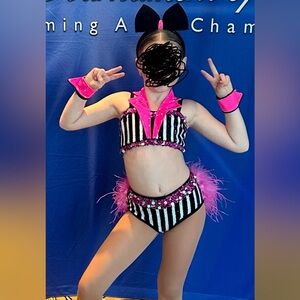 With custom cuffs and headpiece